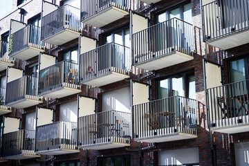 Fototapeta premium many small balconies with tables and chairs at a student residence in cologne