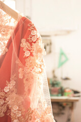 Finished dress hanging on a hanger