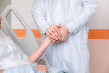 Obraz na płótnie Canvas doctor hands reassuring her female patient. Medicine, help and health care concept.