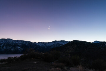 Beautiful sky with shining stars and mountains