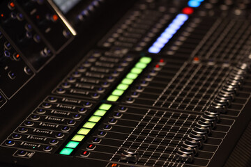 Close up shot of Audio sound mixer&amplifier equipment, sound acoustic musical mixing&engineering concept background, selective focus .control room of a recording studio