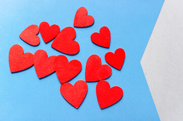 solid blue and blue striped paper background featuring a bunch of red hearts