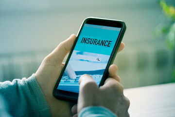 man searches an insurance online