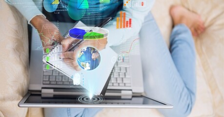 Composition of screen with digital data processing over woman writing using laptop