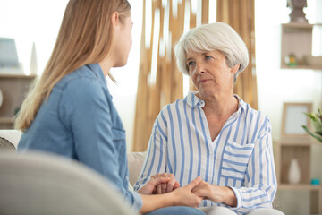 senior mum talking to her daughter