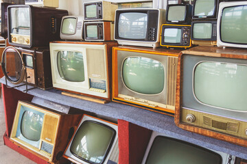 Many retro television. vintage old TV is colorful multi-row.