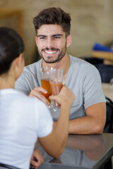 young couple drinking in bar