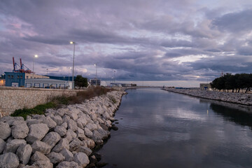 View of the Guadalmedina river in the port of Malaga at night.
