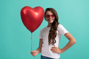 happy kid in sunglasses hold red heart party balloon for valentines day love symbol, love