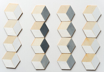 trompe l'oeil cubes loosely arranged on a white background
