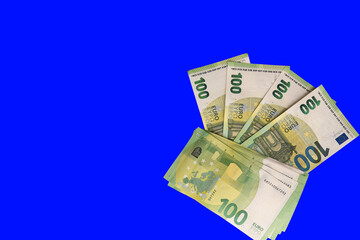 Details in 100 Euros notes - Europe Money Photography with blue background for cut out.