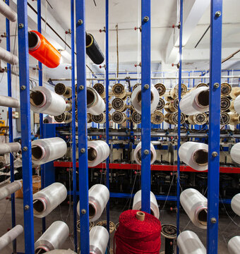 Rows And Columns Of Spindles And Raw Material In A Factory, Idle, Manufacturing Facility, Perspective View,