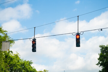 Gainesville, Florida city point of view driving with vertical road sign traffic red light signal...