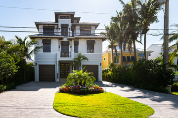 Bonita Springs, Florida gulf of mexico coast with luxury villa mansion house buildings waterfront...