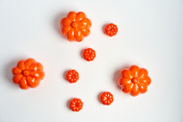 Halloween background, orange decorative plastic pumpkin white cardboard Thanksgiving greeting card