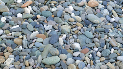 Sea or river gray  pebbles. Natural texture of beach pebbles. Weathering and erosion of rocks. Drainage systems from small pebbles. Garden drainage for plants and trees. Blue stones for roads.