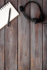 Voip headset on office desk. Call center support or customer service help