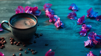 Ceramic cup of black espresso coffee on a neon background with purple bougainvillea flowers