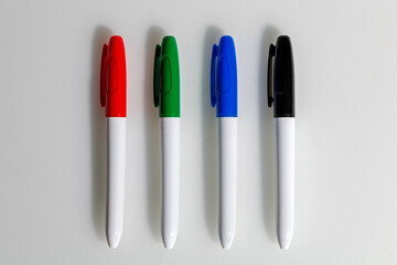 Four multicolored markers on a white background - 442153164