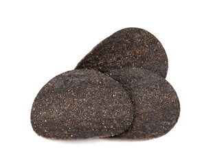 Black potato chips isolated on white background. Black chips with activated charcoal and red pepper.