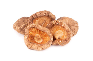 Dried shiitake mushrooms, isolated on white background. Japanese forest mushroom. Lentinula edodes. Close up.