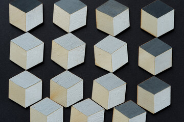 hand painted hexagons in gray and white or trompe l'oeil cubes loosely arranged on dark gray paper background