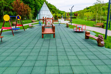 Different equipment on children playground in a city park