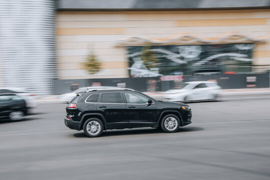 Ukraine, Kyiv - 27 June 2021: Black Jeep Cherokee car moving on the street. Editorial