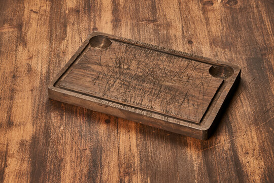 Cutting board on wooden table