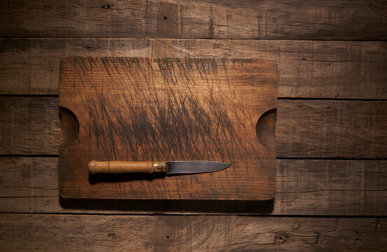 Knife and cutting board on table