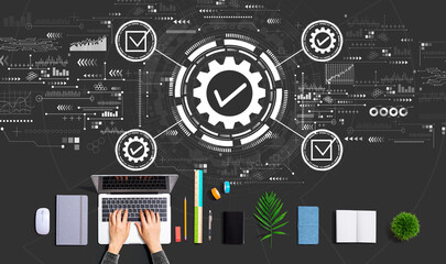 Quality control approval with person using a laptop