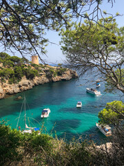 Cala Pi bay in the southern part of Mallorca with crystal clear turquoise water and yachts and...