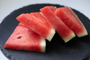 fresh watermelon slices in a white plate