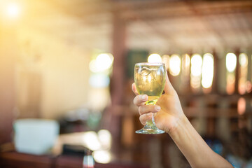 holding a glass of water