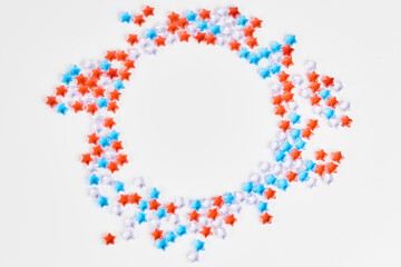beautiful frame of blue, red and transparent stars on a white background. banner for the celebration of Independence Day on July 4th. space for text, flat lay