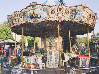 Retro children carousel in the park, empty carousel 