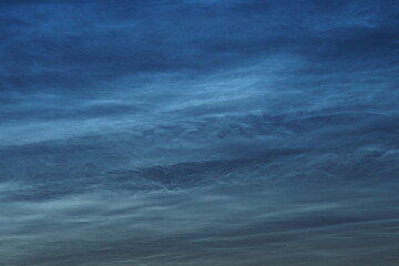 Noctilucent clouds in the night sky. Beautiful natural background. . High quality photo