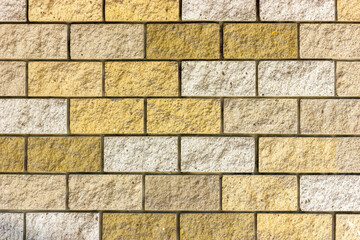 Brick wall texture. Background image of a brick wall. Yellow brick wall. Rough brick texture.