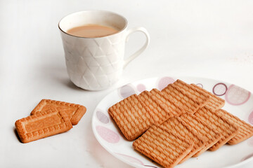 Wheat biscuits in the white plate, Atta biscuit, cookies - close up of a fresh breakfast cookies.