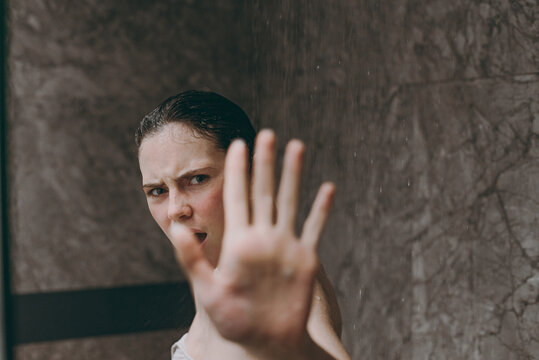 Side View Sad Half Naked Topless Young Indignant Woman 20s Taking Hot Shower Stand Under Water Cover With Palms Hands In Bathroom Brown Background. Skin Care Healthcare Cosmetic Procedures Concept