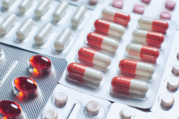 Many multicolored pills and tablets. Close up