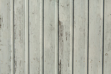 Vintage white wood background texture with knots and nail holes. Old painted wood wall