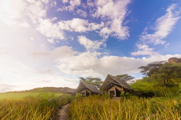 Fotobehang Beautiful view of a safari lodge in Ngorongoro sanctuary, Tanzania © Klaus Heidemann/Wirestock