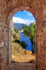 Assos, Greece. Venetian castle ruins. Side gate with beautiful view.