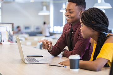 business man and women African American black skin addressing working with laptop corporate business meeting in office.