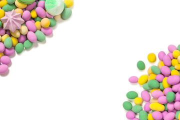 Obraz premium Colorful meringues and glazed peanuts isolated on a white background.