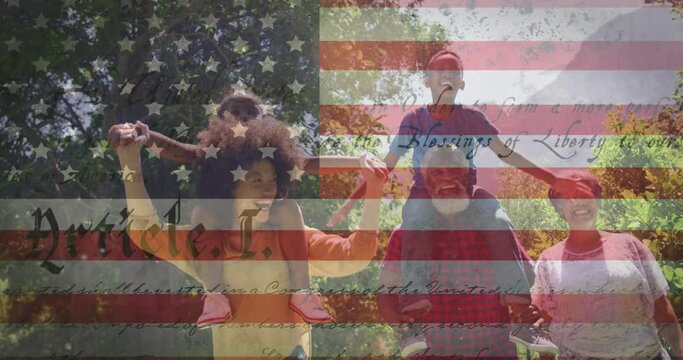 Animation of american flag over family walking in garden and smiling