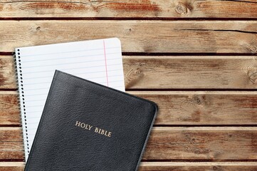 A Stack of books or Notebook on a Rustic Wooden Table