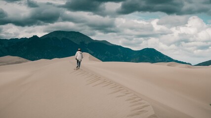 Fototapeta na wymiar Sand dunes desert. Journey to adventure.