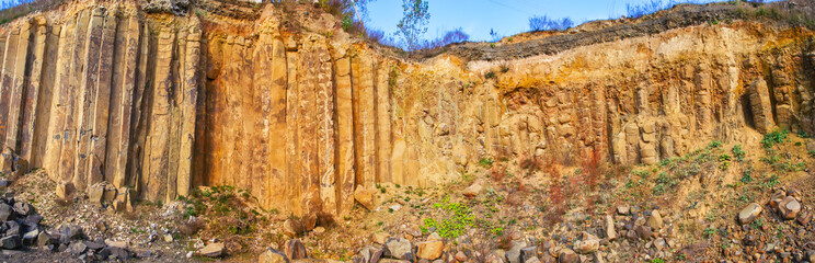High basalt columns in quarry in Ukraine